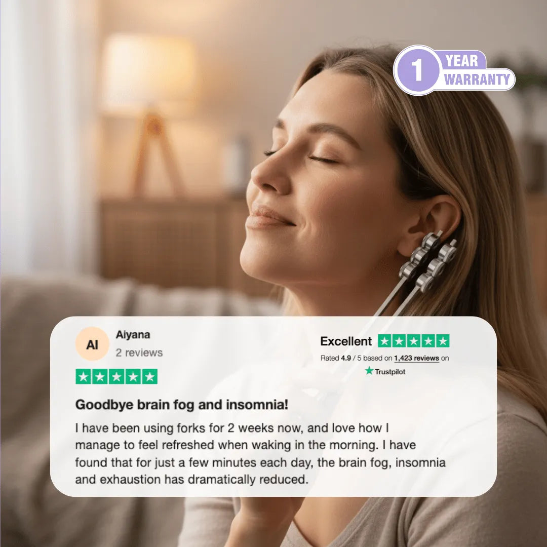 Woman using 32 Hz weighted tuning fork near ear for deep relaxation and nervous system reset