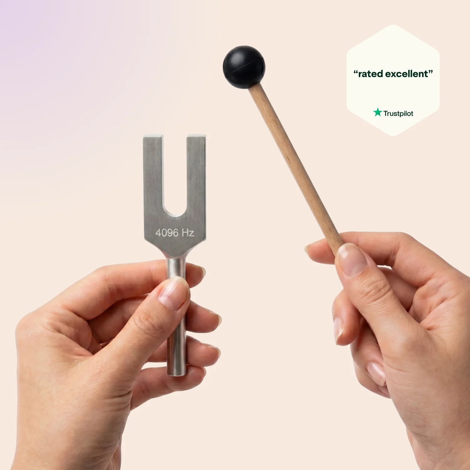 4096 Hz tuning fork and mallet held by hands with 'rated excellent' Trustpilot badge.