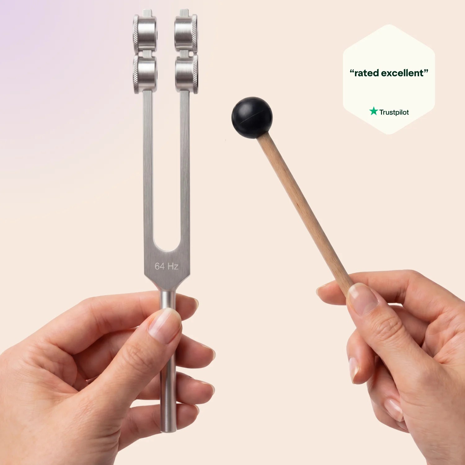 64 Hz tuning fork and mallet held by hands with 'rated excellent' Trustpilot badge on a beige background
