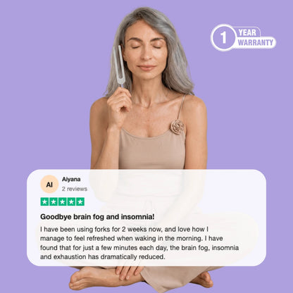 Woman using a tuning fork for sound therapy meditation with customer review about reduced brain fog and better sleep