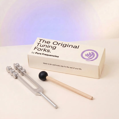 32 Hz tuning fork and packaging with 'The Original Tuning Forks by Pure Frequencies' on a light background