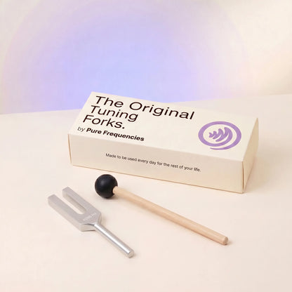 4096 Hz tuning fork with packaging labeled 'The Original Tuning Forks by Pure Frequencies' on a gradient background.